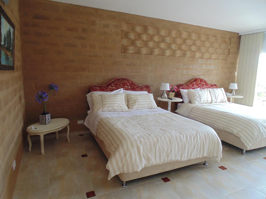 Bella Tierra Hotel Boutique Тибасоса Номер фото