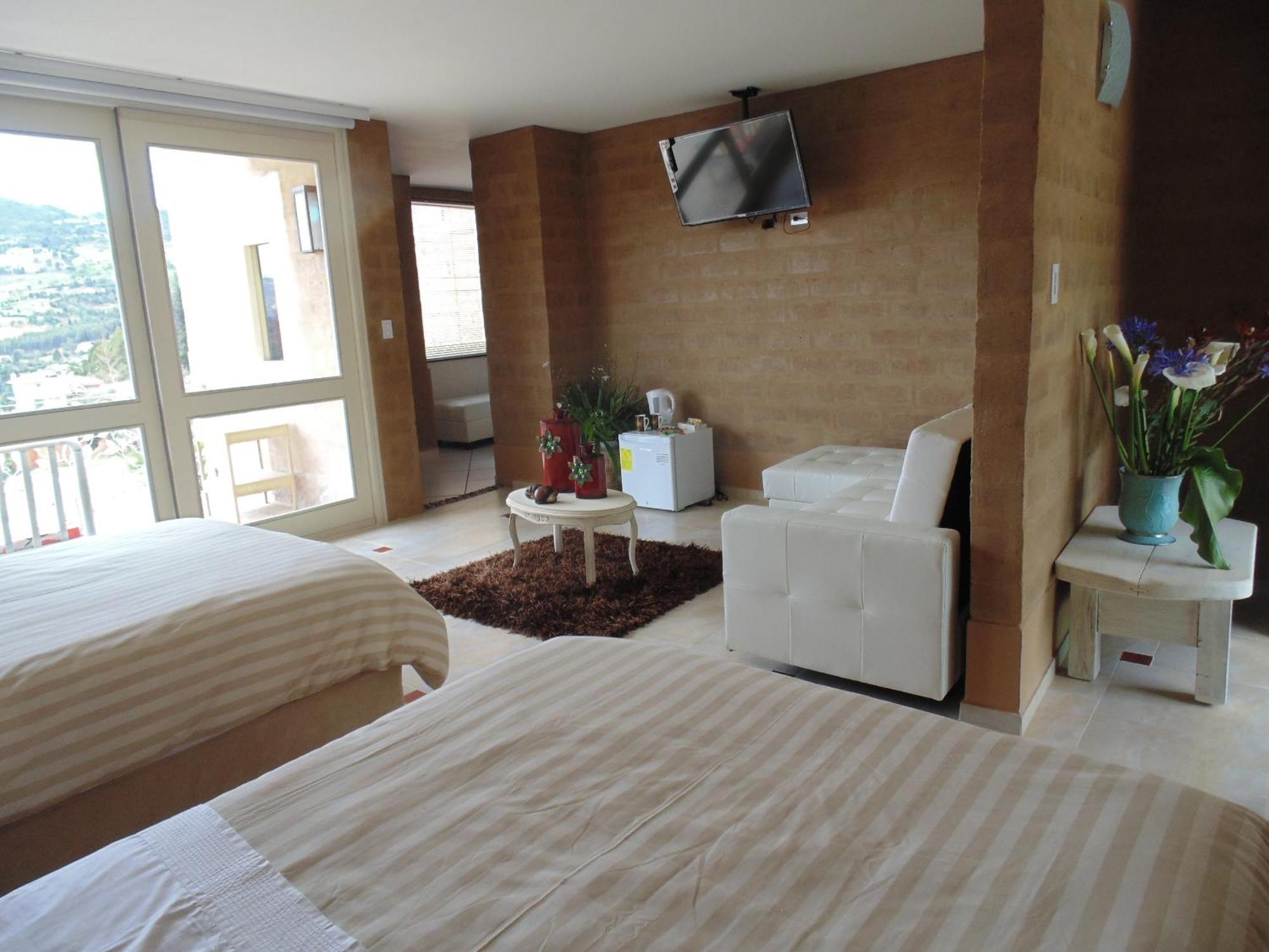 Bella Tierra Hotel Boutique Тибасоса Номер фото