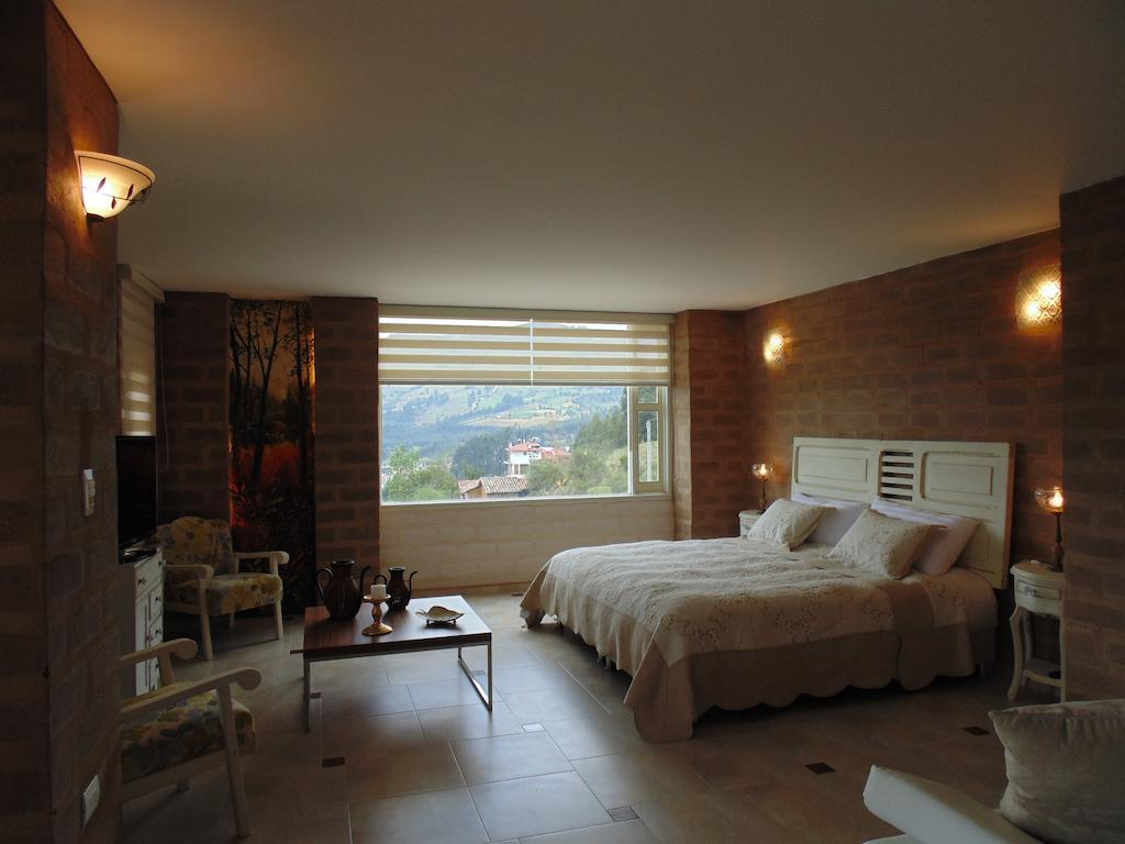 Bella Tierra Hotel Boutique Тибасоса Номер фото